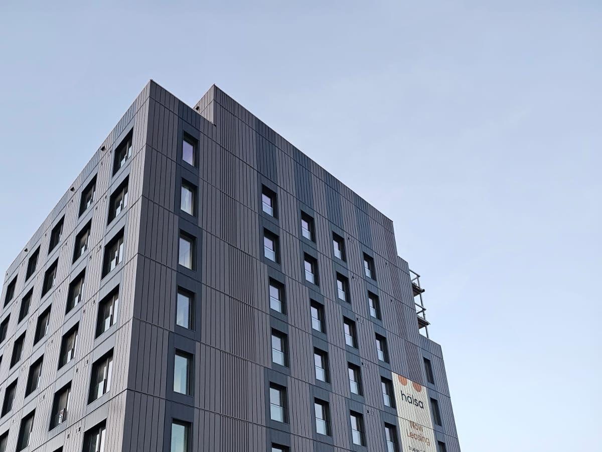 230 Royal York Road, a nine-storey building clad in dark prefabricated facade panels